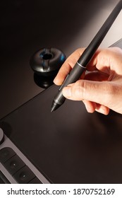 Graphic Designer Working With Graphics Tablet. Dark Background