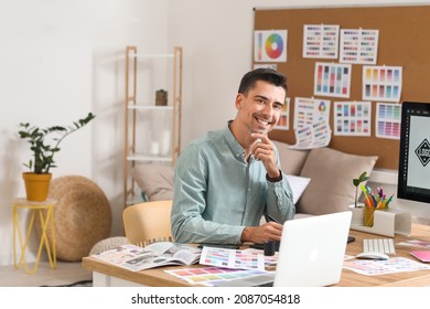 Graphic designer working in office - Shutterstock ID 2087054818