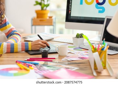 Graphic designer working in office - Shutterstock ID 2087574775