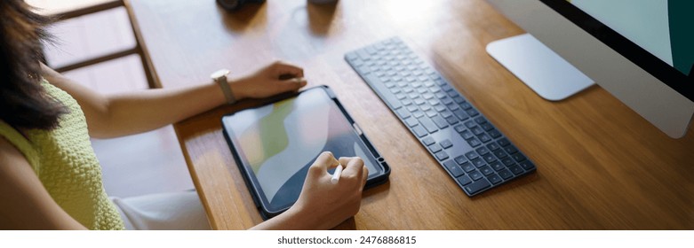 Graphic designer working on digital tablet and computer. Designer Asian Woman artist drawing on graphic tablet  Artist Creative Designer sketch graphic drawing creative - Powered by Shutterstock