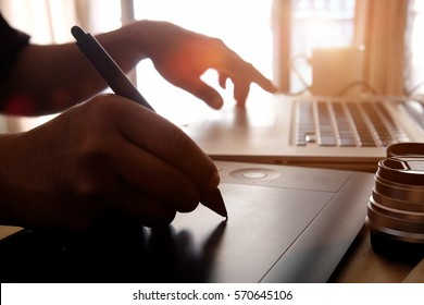 Graphic designer working on digital tablet. - Shutterstock ID 570645106