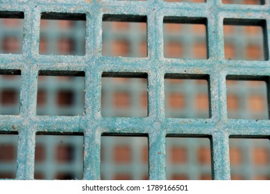 Graphic photo of small squares of a garden shop service cart, repeated through distance.
