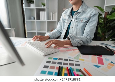 Graphic or UI designer work on computer laptop and with tablet after brainstorming unique design with professional developer UX team - Powered by Shutterstock