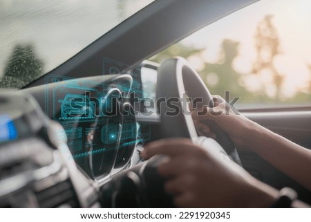 graphic user interface and a futuristic car (GUI). intelligent vehicle connected vehicle The Internet of Things the head-up display (HUD)	