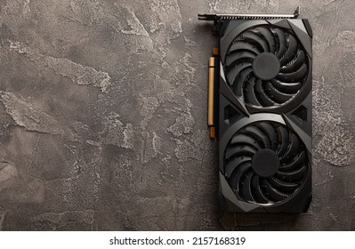 Graphic video card on black cement background. Computer components. Video card for mining and extraction of crypto-currencies. Place to copy.
