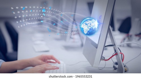 Graphic of world and binar code wave over desk with row of monitors. global technology, data processing and digital interface concept digitally generated image.