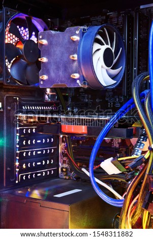 Graphics Card or GPU to video output the plugs into a slot on the motherboard  to connect a monitor to your computer. Heatsink and fan of central processing or the CPU cooler inside pc system unit.