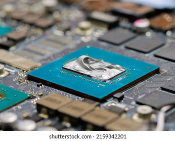 Graphics Processor, GPU On The Motherboard Of A Laptop Computer, With Thermal Paste Applied In The Centre Of The Die.