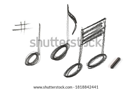 Graphite stick with musical notes hatching, sketching isolated on white background, top view