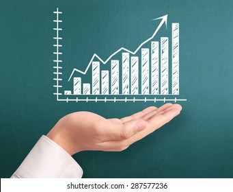 Graphs on the hand, meeting concept - Shutterstock ID 287577236