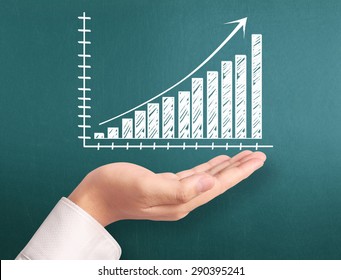 Graphs on the hand, meeting concept - Shutterstock ID 290395241