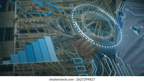 Grasping hand connecting Ethernet cables to patch panel ports at data center, with digital overlays. Technology, infrastructure, connectivity, data, industrial, digital, networking