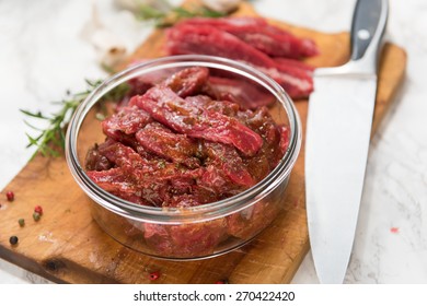 Grass Fed Flank Steak Sliced and Mixed with Marinade to Make Beef Jerky