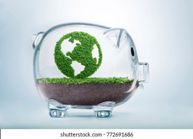 Grass growing in the shape of planet Earth, inside a transparent piggy bank, symbolising the need to invest in the protection of the environment and to reconnect with nature.