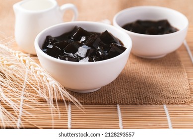 Grass jelly or herb jelly, dessert in Southeast Asia made from plant eating with syrup, bubble tea or other drinks