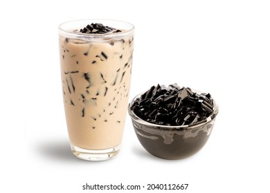 Grass jelly with milk in glass isolated on white background. - Shutterstock ID 2040112667