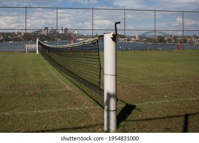 Grass Tennis Court Wtih City Skyline