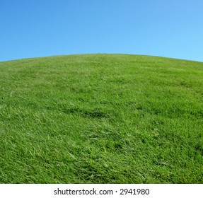 Grassy Hill And Blue Sky