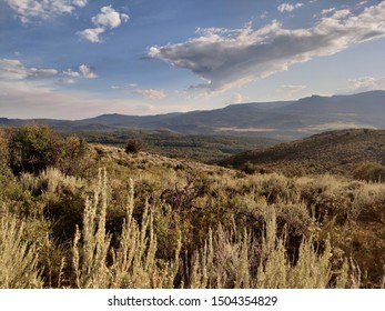 Grassy Mountains and Sky with Clouds