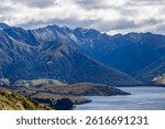 Grassy mountains surround Hawea Lake. South Island, New Zealand