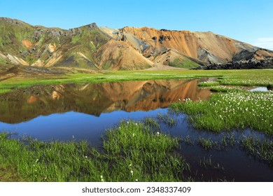 Grassy plains and colourful mountains at Landmannalaugar, Fjallabak Nature Reserve, Sudurland, South Iceland, Iceland