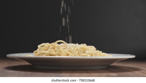 Grated Aged Parmesan Cheese Falling On Spaghetti