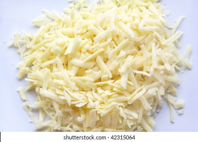 Grated Cheddar Cheese In A Pile Isolated