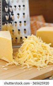 Grated cheese on the wooden table