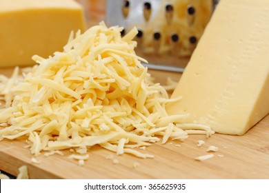 Grated cheese on the wooden table