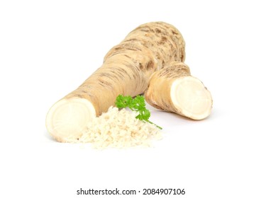 Grated horseradish with parsley on white background.