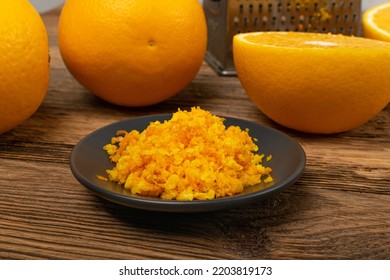 Grated Orange Rinds Pile. Raw Homemade Citrus Peel, Grated Orange Skin, Fresh Zest on Wood Rustic Background