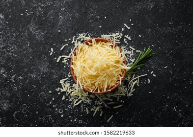 Grated Parmesan cheese in a bowl. Top view. Free space for your text. - Powered by Shutterstock