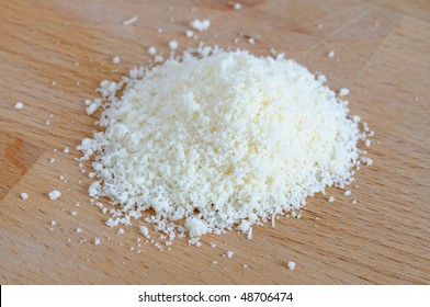 Grated Parmesan Cheese On Table