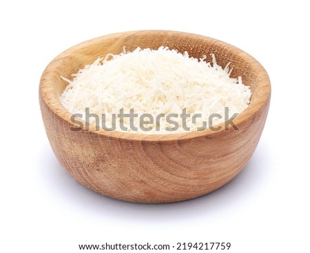 grated Parmesan cheese in wooden bowl isolated on white background