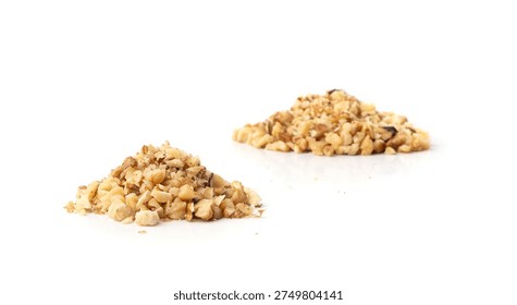 Grated wallnut , broken roasted walnuts powder, heap of chopped nuts crumbs, whole kernel pieces, fractions, powder side view on white background