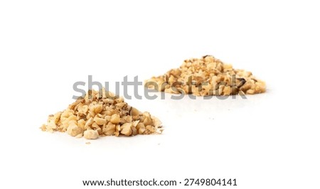 Grated wallnut , broken roasted walnuts powder, heap of chopped nuts crumbs, whole kernel pieces, fractions, powder side view on white background