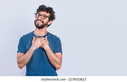 Grateful people smiling with hands on chest. Positive looking friendly handsome man with charming sincere smile feeling thankful, relaxed person with thanks gesture with hands on chest. - Shutterstock ID 2178533813