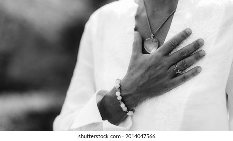 Gratefulness – Woman expressing gratitude with hands. Close up image of female hands in prayer position outdoor. Self-care practice for wellbeing