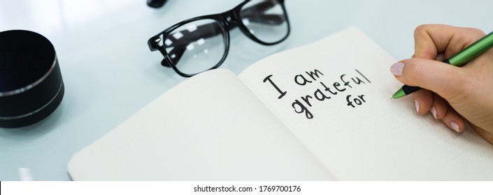 Gratitude Journal Concept. Writing I Am Grateful In Journal - Shutterstock ID 1769700176