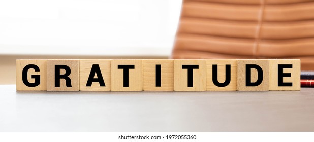 Gratitude Word Written On Wood Block. Gratitude Text On Wooden Table For Your Desing, Concept