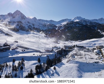 Grau Roig Grandvalira Ski Station From Above, Drone Aerial Capture Of The Ski Resort With Scenic Snow Mountain Range, Sun And Blue Sky Background. One Of The Main Spots Of Winter Sports In Andorra.