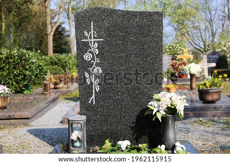 Grave with beautiful gravestone, close up