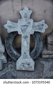 Grave Marker And Old Tire