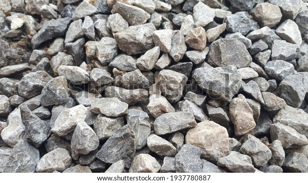 Gravel outdoor  road. Closeup gravel texture.\
Stone pattern. Small rocks\
ground