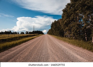 Gravel ridge road in Red Deer Country, Alberta, Canada. Deserted, nobody around, open country