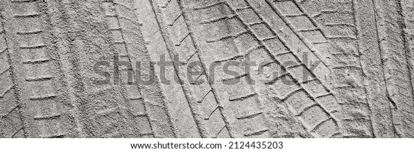 Gravel road
with car tire tracks. Panoramic
image