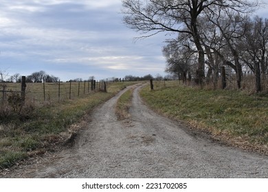 Gravel road in a farm field - Powered by Shutterstock