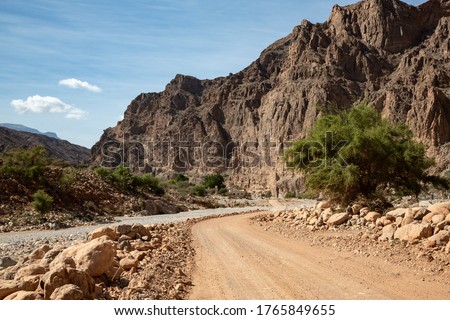 Gravel road and landscape in Oman's Wadi Arbiyeen