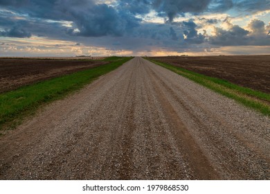 Gravel road in the saskatchewan prairies at sunset