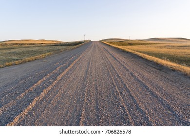 Gravel Road At Sunset In Saskatchewan, Canada.